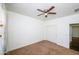 Bedroom with double door closet and ceiling fan at 7917 W Sierra Vista Dr, Glendale, AZ 85303