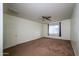 Bright bedroom with ceiling fan and window coverings at 7917 W Sierra Vista Dr, Glendale, AZ 85303