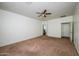 Bedroom with access to bathroom and ceiling fan at 7917 W Sierra Vista Dr, Glendale, AZ 85303