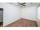 Bright bedroom with ceiling fan and brown carpet at 7917 W Sierra Vista Dr, Glendale, AZ 85303