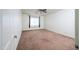 Spacious bedroom with ceiling fan and brown carpet at 7917 W Sierra Vista Dr, Glendale, AZ 85303