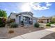 One-story home with gray exterior, stone accents, and landscaped front yard at 7917 W Sierra Vista Dr, Glendale, AZ 85303