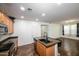 Modern kitchen with dark wood cabinets, granite countertops, and stainless steel appliances at 7917 W Sierra Vista Dr, Glendale, AZ 85303