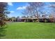 Expansive backyard with a lush lawn, mature trees and a sparkling pool for outdoor enjoyment at 8031 N 14Th Ave, Phoenix, AZ 85021