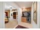 Stylish bar area with custom cabinets, granite countertops, and a built-in wine fridge at 8031 N 14Th Ave, Phoenix, AZ 85021