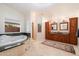 Bright bathroom with a luxurious tub, a separate walk-in shower, and and sinks with wood cabinets at 8031 N 14Th Ave, Phoenix, AZ 85021