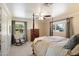 Comfortable bedroom featuring large windows for plenty of natural light and a four-poster bed at 8031 N 14Th Ave, Phoenix, AZ 85021