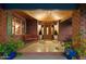 Inviting front porch with wood ceiling, brick facade, bench, and a beautifully designed doorway at 8031 N 14Th Ave, Phoenix, AZ 85021