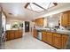 Bright kitchen with stainless steel appliances, tile backsplash, and decorative ceiling light at 8031 N 14Th Ave, Phoenix, AZ 85021