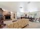 Bright living and dining space featuring a fireplace, neutral carpeting, and an elegant chandelier at 8031 N 14Th Ave, Phoenix, AZ 85021