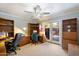 Office space with built in shelves, a ceiling fan, and glass patio doors leading to the backyard at 8031 N 14Th Ave, Phoenix, AZ 85021