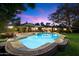 Backyard pool featuring lights and a patio with table and chairs at 8031 N 14Th Ave, Phoenix, AZ 85021