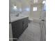 Updated bathroom with gray vanity, white countertop, and tile flooring at 813 S Doran Cir, Mesa, AZ 85204