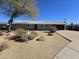 Ranch style home with gray exterior, landscaping, and a two-car garage at 813 S Doran Cir, Mesa, AZ 85204