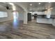 Open concept kitchen with white cabinets, stainless steel appliances, and modern backsplash at 813 S Doran Cir, Mesa, AZ 85204