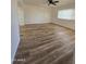 Living room with wood-look floors and a large window at 813 S Doran Cir, Mesa, AZ 85204