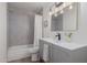 Clean bathroom with gray tile and modern vanity at 8241 N Central Ave # 13, Phoenix, AZ 85020