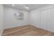 Simple bedroom with light walls, wood floors and double door closet at 8241 N Central Ave # 13, Phoenix, AZ 85020