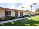 Light-colored building with landscaping and palm trees at 8241 N Central Ave # 13, Phoenix, AZ 85020