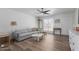 Living room with gray couch, white cabinet, wood floor at 8241 N Central Ave # 13, Phoenix, AZ 85020