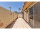 Private tiled patio with block wall and partial view of landscaping at 8241 N Central Ave # 13, Phoenix, AZ 85020