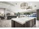 Open concept kitchen with marble countertops and a large island at 9016 N 60Th St, Paradise Valley, AZ 85253