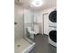 Updated bathroom with a walk-in shower, toilet, and laundry at 908 E Cavalier Dr, Phoenix, AZ 85014