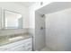 Bathroom with walk-in shower and granite vanity at 908 E Cavalier Dr, Phoenix, AZ 85014