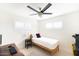 Bright bedroom with a bed, desk, and ceiling fan at 908 E Cavalier Dr, Phoenix, AZ 85014