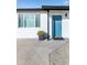 Contemporary teal front door with updated landscaping at 908 E Cavalier Dr, Phoenix, AZ 85014