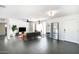 Bright living room with dark gray couch and large TV at 908 E Cavalier Dr, Phoenix, AZ 85014