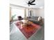 Living room with gray couch, coffee table, and large window at 908 E Cavalier Dr, Phoenix, AZ 85014