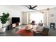 Mid century modern living room with a gray couch and area rug at 908 E Cavalier Dr, Phoenix, AZ 85014