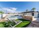 Private pool area with lounge chairs and built-in grill at 908 E Cavalier Dr, Phoenix, AZ 85014