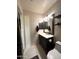 Elegant bathroom with a double vanity and hexagon tile floor at 9207 W Highland Ave, Phoenix, AZ 85037