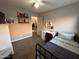 Well-lit bedroom featuring a desk and full-size bed at 9207 W Highland Ave, Phoenix, AZ 85037