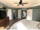 Primary bedroom with barn door entry and large mirror at 9207 W Highland Ave, Phoenix, AZ 85037