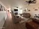 Spacious living room with comfy seating and large TV at 9207 W Highland Ave, Phoenix, AZ 85037