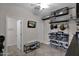 Organized laundry room with storage shelves and bench at 9236 E Canyon View Rd, Scottsdale, AZ 85255