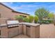 Outdoor kitchen with grill and mini-fridge at 9236 E Canyon View Rd, Scottsdale, AZ 85255