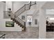 Elegant curved staircase with wrought iron railing leading to upper level at 9236 E Canyon View Rd, Scottsdale, AZ 85255