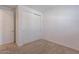 Spacious bedroom with double door closet and neutral decor at 9835 E Wavelength Ave, Mesa, AZ 85212