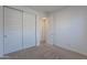 Bright bedroom with double doors and plush carpet at 9835 E Wavelength Ave, Mesa, AZ 85212