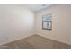 Simple bedroom with neutral wall and carpet at 9835 E Wavelength Ave, Mesa, AZ 85212