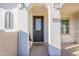 Inviting entryway with dark gray door and shutters at 9835 E Wavelength Ave, Mesa, AZ 85212