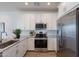 Modern kitchen features stainless steel appliances and white cabinetry at 9835 E Wavelength Ave, Mesa, AZ 85212