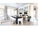 Bright dining room with large table and statement lighting at 10018 E Hillside Dr, Scottsdale, AZ 85255