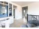 Light-filled hallway with built-in shelving and access to other rooms at 10018 E Hillside Dr, Scottsdale, AZ 85255