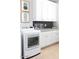 Bright laundry room with white cabinets and a countertop at 10018 E Hillside Dr, Scottsdale, AZ 85255