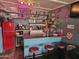 Fun basement bar with red refrigerator and stools at 1041 E 9Th Dr, Mesa, AZ 85204